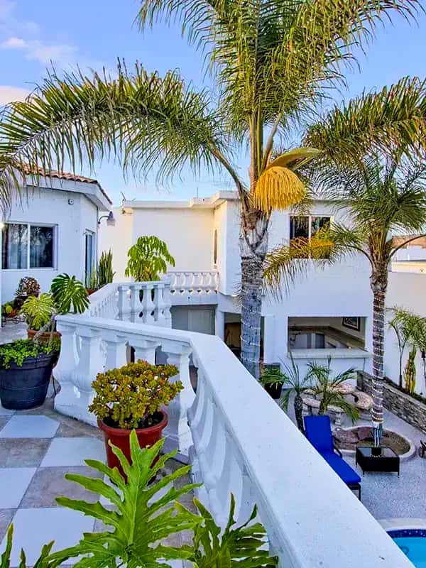 twilight balcony pool palm trees